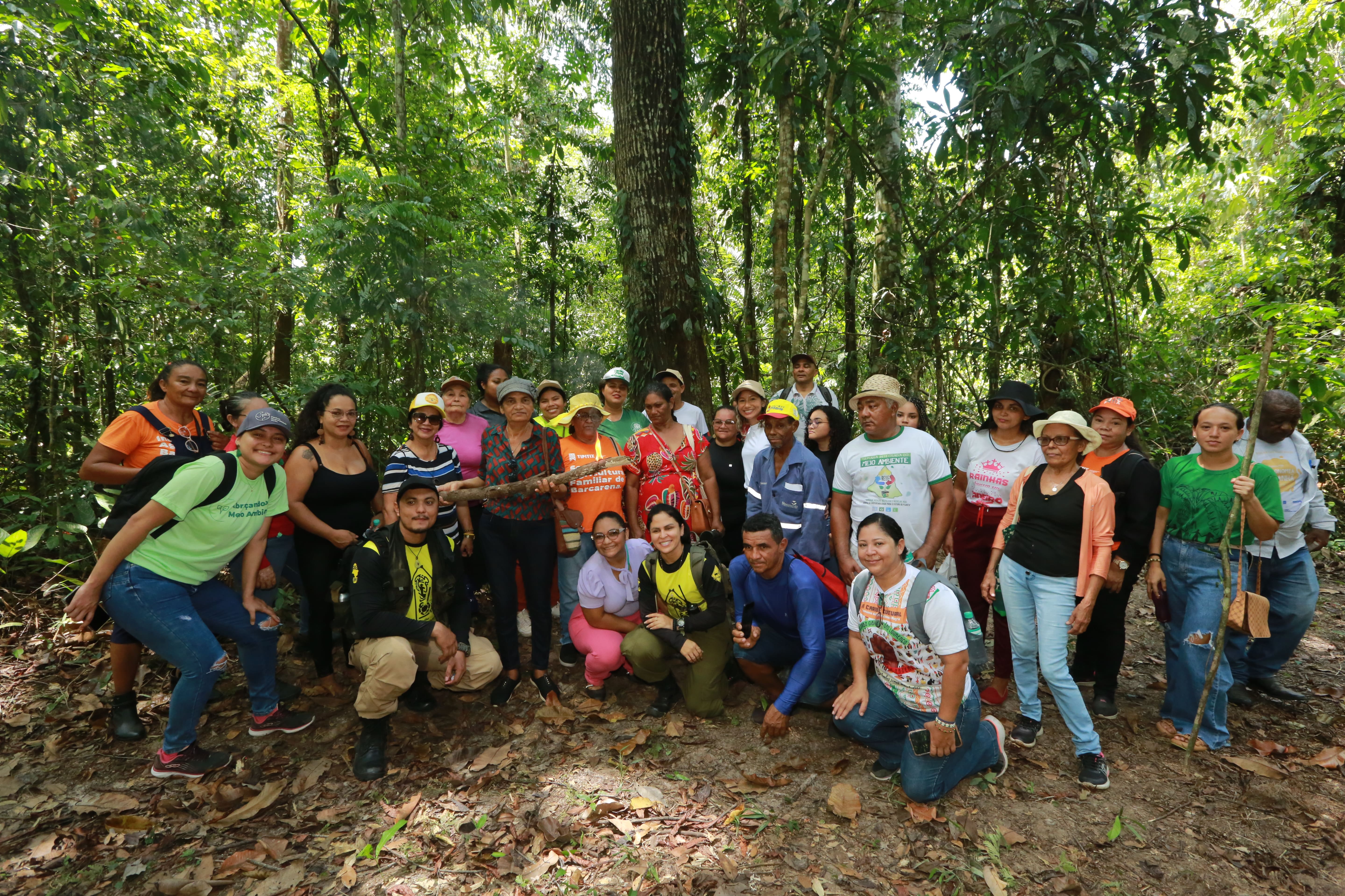 a group of people posing for a photo in the woods