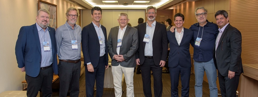 a group of men posing for a photo