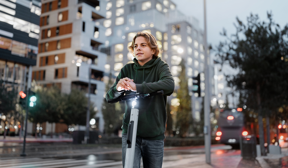 Young guy on a scooter in the city