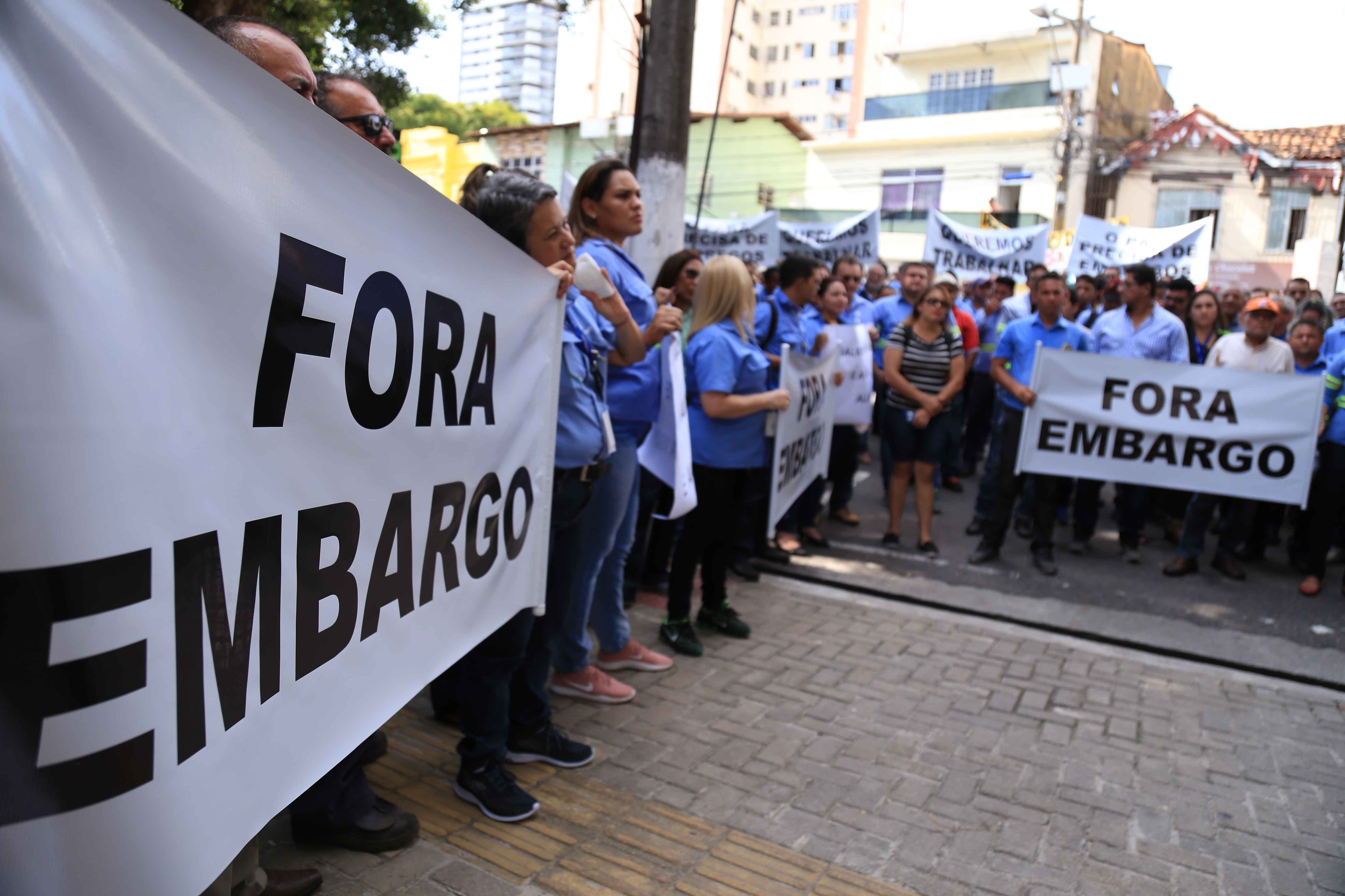 a group of people holding signs