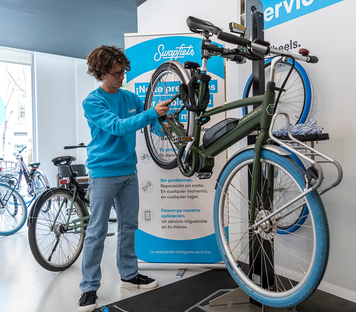 a person standing next to a bicycle