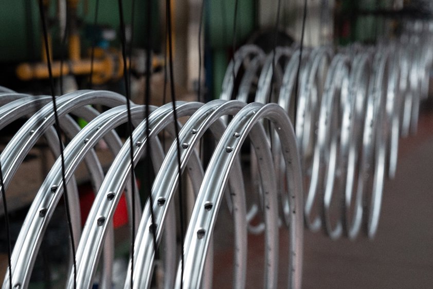 a row of bicycle rims