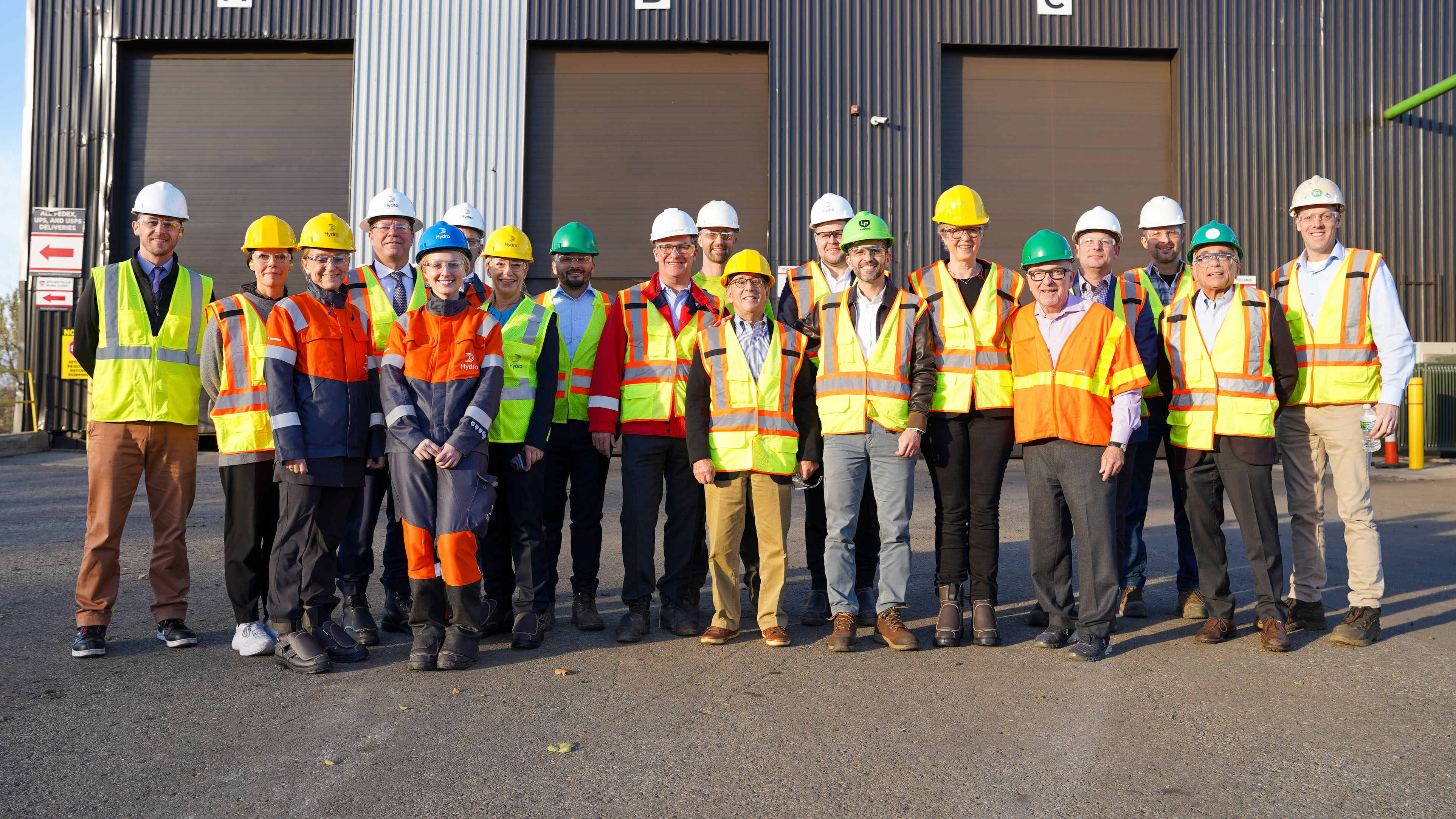 a group of people wearing safety vests
