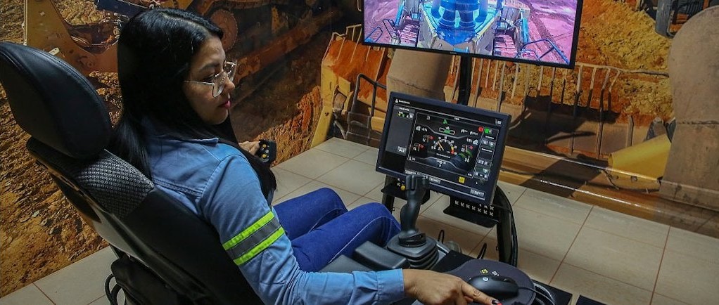 a man sitting in a chair with a computer