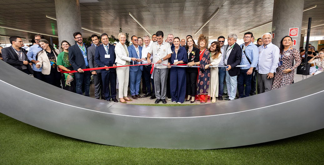 a group of people standing on a black platform