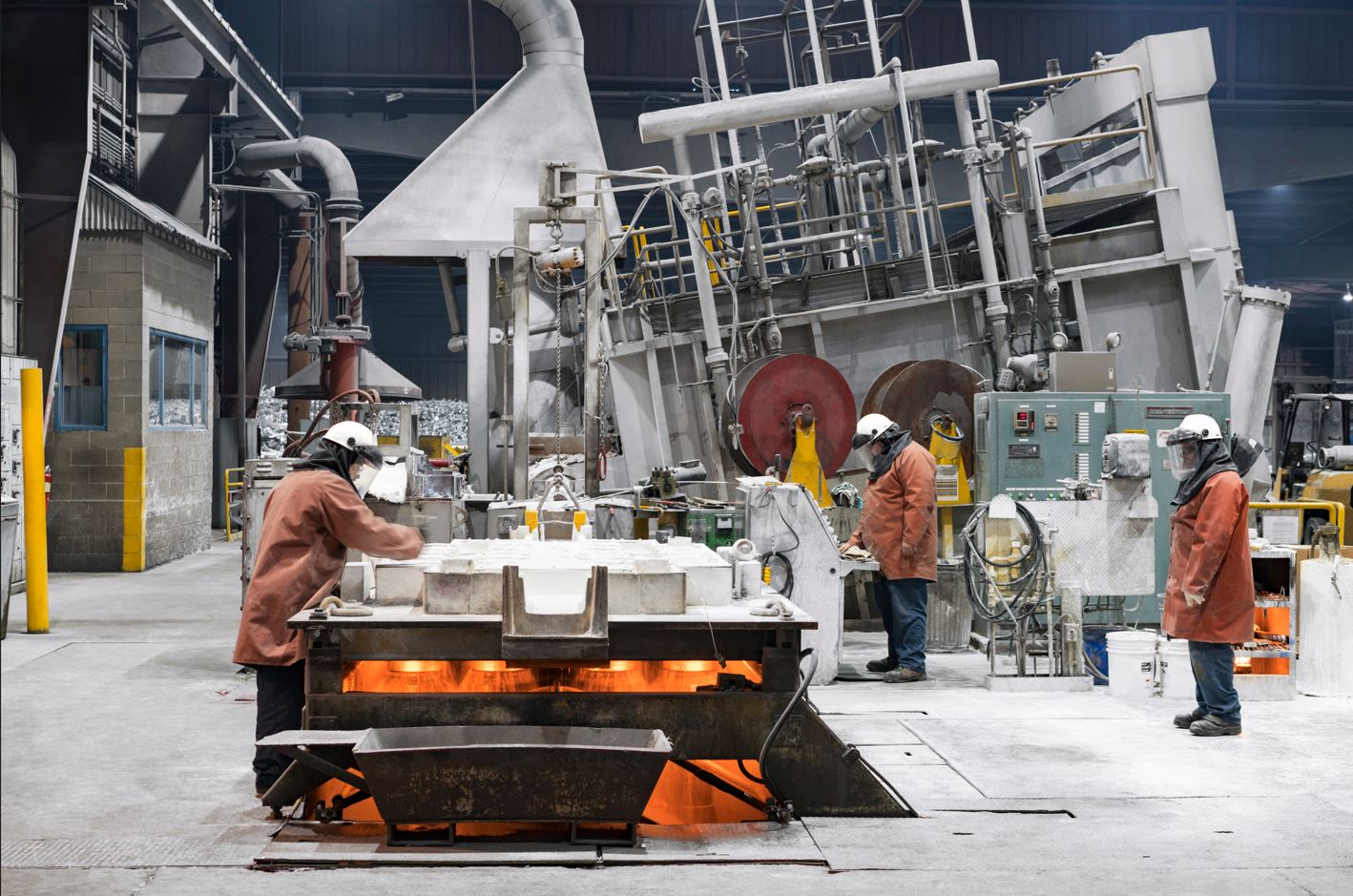 a group of men working on a machine