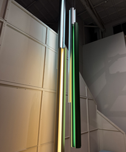 a green and white object on a white surface